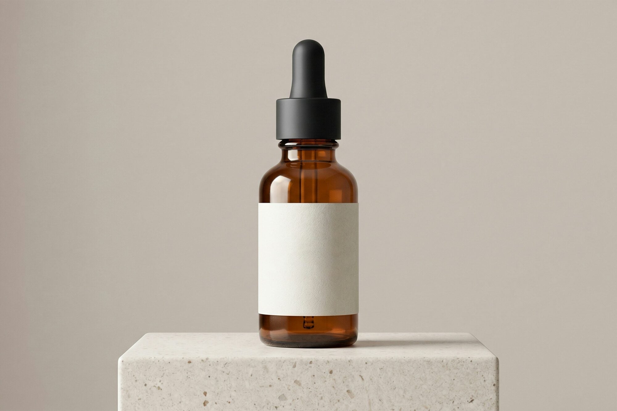 Cygneia neck cream amber dropper on stone